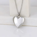 Polished silver heart locket pendant necklace for women on minimalist white display - Smooth Heart 23*25/Steel