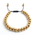 Detailed macro view of adjustable black braided rope bracelet with polished gold beads - Gold Color 8MM