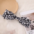 Elegant grey leopard print knit bow hair claw clip for a stylish bun hair style - Grey Leopard Spring Clip