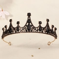 Close-up of vintage black gemstone bridal crown with ornate bronze metalwork and details - Bronze/Medium Black Stone
