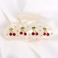 White acrylic hair claw clip with red and green rhinestone cherry pattern on silk - Off White