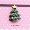 Detail view of a 2.2x2.9cm green glitter Christmas tree resin charm with a gingerbread man - Dark Green Tree with Yellow Star