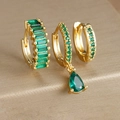 Macro view of gold-plated geometric earring set featuring emerald green drop crystals - Three-Piece Set / Gold - Green Zirconia