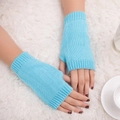 Detail of light blue knitted fingerless gloves with elastic texture and warm long wrist cuffs - One Size / Light Blue