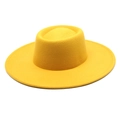 Macro detail of high-quality bright yellow wool felt fedora with fine stitching on brim - Yellow