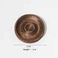 Detail view of a 10cm round dark wood display tray with a 1.5cm thickness for jewelry - Walnut Round (10cm)