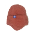 Detail of brick red knit hat featuring fuzzy faux mink fur and ear flaps with snowflake tag - M / Caramel color