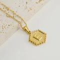 Gold hexagon pendant necklace featuring a raised letter E on a textured white stone base - Letter E (Single Pendant)