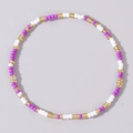 Minimalist beaded bracelet with purple, white and gold seed beads in a circular pattern - Purple White Gold