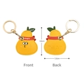 Pear-shaped yellow leather AirTag case with green leaf detail and golden keychain - Fighting Pear