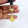 Cute yellow enamel duck keychain with golden heart-shaped clasp and black lanyard cord - Duck