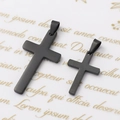 Detail view of two black matte stainless steel cross pendants in different sizes - 14*21mm Pendant / Black