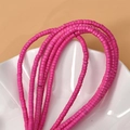 Macro shot of 2x4mm pink turquoise spacer beads for DIY jewelry making and necklace crafts - 2*4mm (Approx. 150 Pcs/Strand) / Rose Red