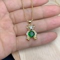 Macro view of gold teddy bear pendant with green round stone and zircon pave details - Green Stone Style (D)