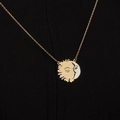 Minimalist sun and moon pendant necklace with gold and silver finish on black fabric - Two Colors