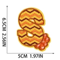 Detailed view of letter S embroidery patch with orange wave patterns and size dimensions - Letter S