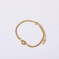 Detail of gold lover's knot bracelet with Cuban chain, lobster clasp and K18 hallmark - Knot Bracelet (16+5cm) / 18K Gold