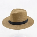 Close-up of the woven straw texture and black grosgrain ribbon on this summer sun hat - 58cm / Brown
