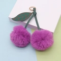 Detail of red plush cherry keychain with faux fur pom poms and green leather leaves - Spring Ring / Deep purple