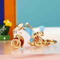 Blue and gold motorcycle keychain with rhinestones and enamel finish for women - Motorcycle Blue