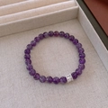 Detail of purple crystal beads with silver zirconia spacer on a beige jewelry tray - 16# Zirconia Cylinder Ball Amethyst Bracelet 6mm - Gift Box
