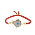 Adjustable red rope bracelet with gold fish charm and crystal evil eye detail - Red Rope