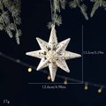 White and gold octagonal star Christmas ornament with glitter detailing on pine branch - Octagonal Star White Gold Pendant