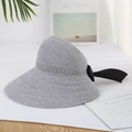 Grey woven straw sun hat with large black bow and wide brim for beach summer sun protection - Adjustable / Gray