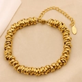 Macro shot of gold-plated stainless steel multi-layered chain bracelet with S-Steel tag - Gold (B-51)