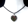 Green and red natural stone heart pendant necklace displayed on a white mannequin - Dragon Blood Stone