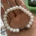 White beaded bracelet featuring a grey metal dumbbell charm with Live Lift engraving - White Silver