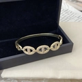 Bracciale rigido dorato regolabile con maglie a catena d'ancora in cristalli lucidi - Design a Catena d'Ancora