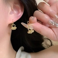 Detailed view of elegant gold beaded drop earrings held by hand to show premium texture - Gold Beaded Hook Style