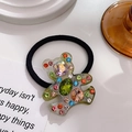 Charming bear hair tie featuring clear resin bear charm with colorful crystal rhinestones - Metallic Green