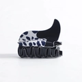 Classic British style hair claw clip featuring a black and white polka dot pattern finish - Black White Polka Dot Boot Style