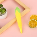Novelty yellow corn squishy decompression pen with green husk on pink background - Corn