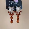 Détail macro des boucles d'oreilles papillon en argent avec perles d'ambre et S925 - 21# Papillon en Argent et Perles d'Ambre (Tige en Argent)