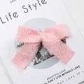 Pink plush bow decoration crafted from soft faux fur material for Christmas tree decor - Teddy Fleece / Pink