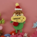 Handmade crochet sausage mouth key case in green with a red and white Santa hat decor - Green Christmas Curly Hair