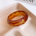 Detailed macro view of faceted amber resin bangle with retro geometric cutting - 32# Dark Brown Geometric Cut (32# Bangle - Dark Brown)