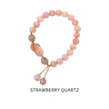 Detail of pink strawberry quartz beads with golden Pixiu charm on a delicate bracelet - Strawberry Quartz Pixiu Pink-Orange Style (WB335)