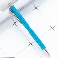 Blue glitter retractable ballpoint pen with metallic silver clip and nib on white grid - Blue (Silver Parts)