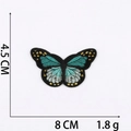 Detailed view of blue butterfly embroidered patch with dimensions 8cm by 4.5cm - No.21 Teal Butterfly