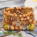 Mehrlagiges gelbes Perlenarmband-Set im Boho-Stil mit einem goldenen Schmetterling - Gelber Kaffee