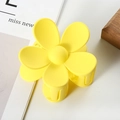 Detail view of the yellow matte floral hair claw clip featuring a five-petal flower design - 7cm / Yellow