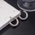 Silver twisted C-shape hoop earrings with a textured spiral finish and stud backing - E-081---Platinum