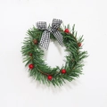 Artificial Christmas wreath with pine needles, red berries, and black-white plaid bow - 10 Berries / Black and White Plaid