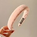 Pink velvet padded headband with textured pattern and handmade label held by hand - Orange Pink
