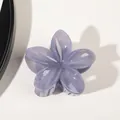 Top view of a lavender translucent flower hair claw clip with a glossy resin finish - Jelly Blue Grey