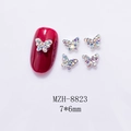 Macro view of 7x6mm mini metal butterfly nail charms with colorful iridescent rhinestones - Aurora Diamond Silver Base Butterfly (8823)